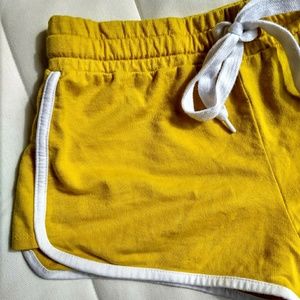 mustard yellow shorts w/ white stripe 🌟